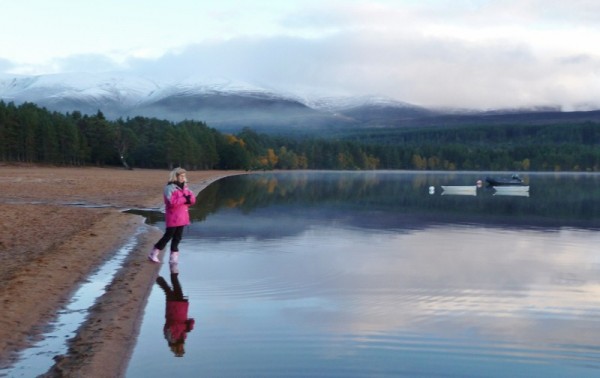 334 Laura & reflection on Loch Morlich