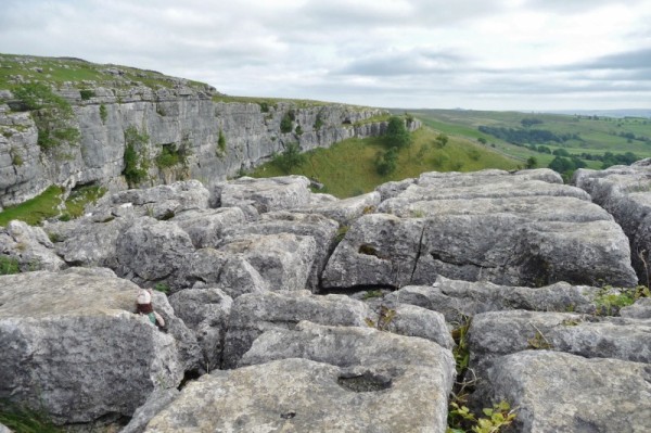 Struggling Across The Rocks At Malham Cove Yorkshire 
