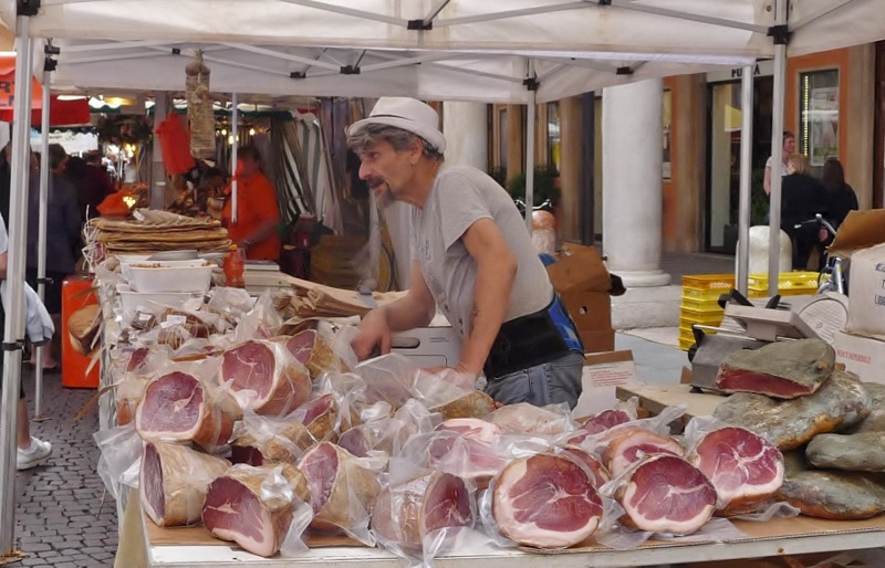 Ham seller in the Modena market