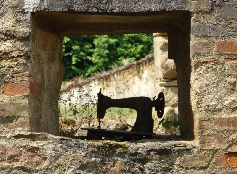 One of many sewing machines left in the ruins