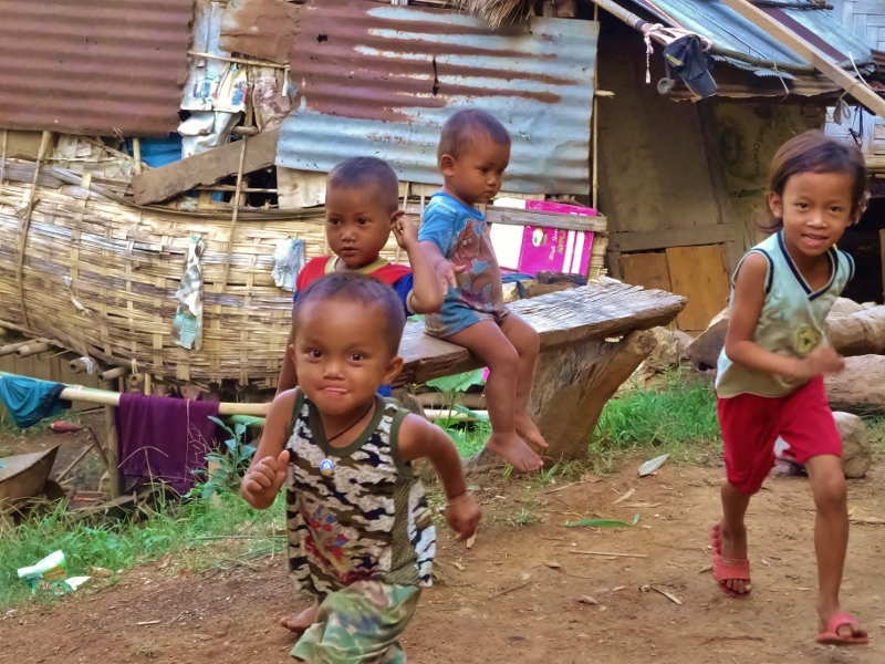 Happy Kamu village children on Mekong river